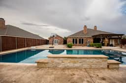 The ultimate resort ranch style pool home on nearly a half acre!